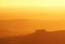D58-19 Kirkcarrion Through Mist at Sunset.  Taken from Monks Moor, Teesdale County Durham.